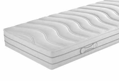 Weiße Matratze mit Wellenmuster.