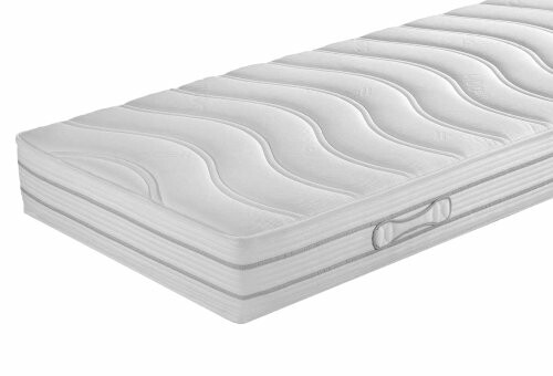 Weiße Matratze mit wellenförmigem Muster.